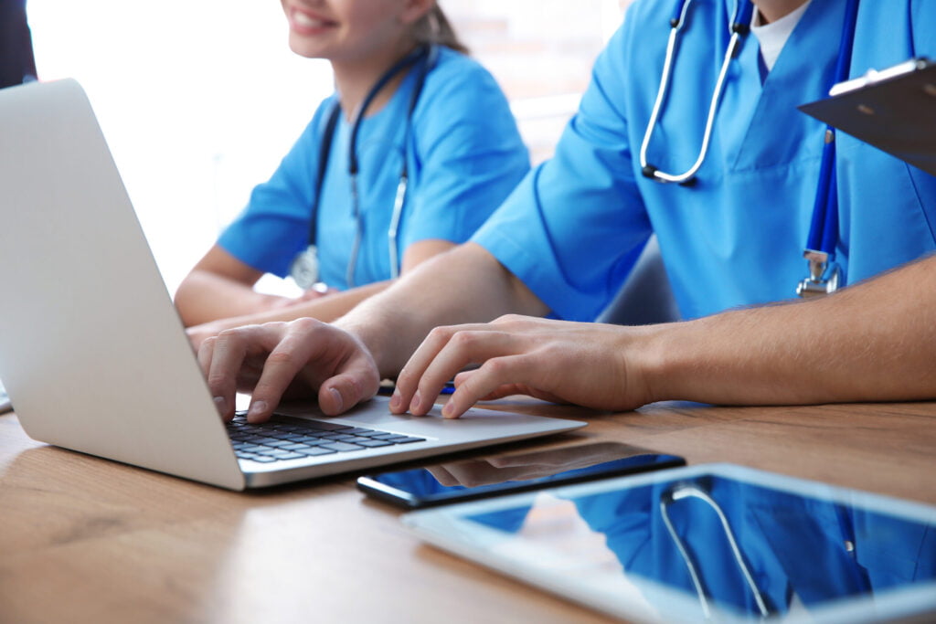 Medisonal doctors learning on laptops